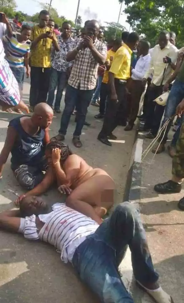 Woman and Two Others Stripped N*ked as Angry Mob Beat Them to Pulp in Lagos... Find Out Why (Photos)